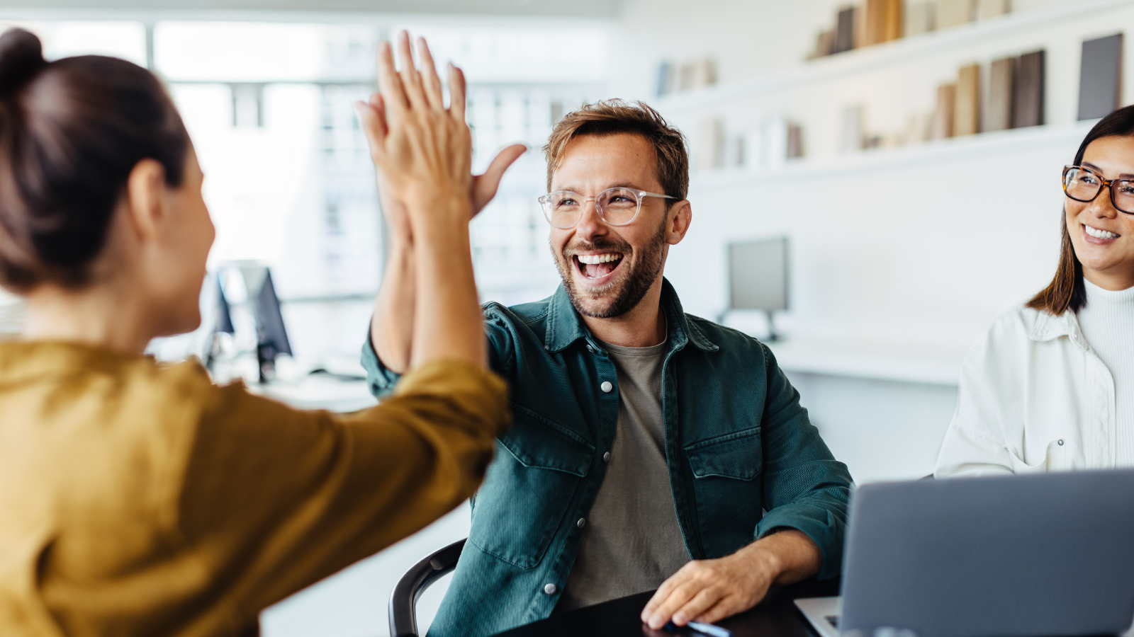 real estate agents high fiveing