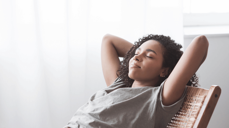 Woman leaning back in chair relaxing | real estate slow season