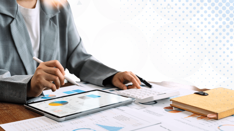 Person reviewing finances | Streamlining Brokerage Finances Strategies for Year-Round Efficiency